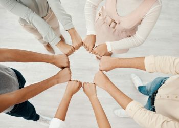 Corporate teamwork, fist bump hands of people in company diversity together and global business con